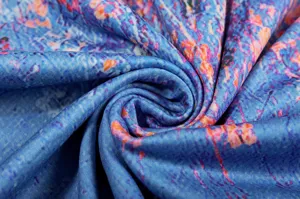 Blue floral print fabric close up detail, soft textile material for women long sleeve top clothing.