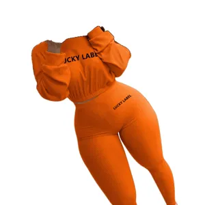 Orange ribbed two piece tracksuit women long sleeve crop top and leggings main product view