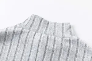 Grey ribbed turtleneck knit sweater detail, cozy autumn long sleeve top close up view.