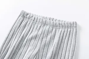 Close-up of women's grey knitted striped trousers elastic waist detail cozy casual style