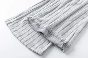 Grey ribbed knit fabric cuff and hem detail shot showcasing soft texture and quality.