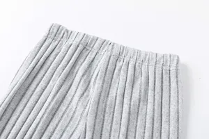 Grey knitted trousers detail featuring soft ribbed texture and comfortable elastic waistband.