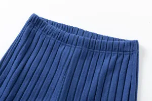 Blue knit pants detail view showcasing soft ribbed waistband and premium fabric texture.