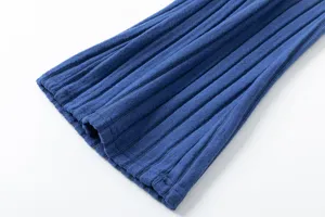 Blue knitted fabric detail close-up showing fine vertical ribbed texture and soft material.