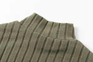 Green ribbed mock neck sweater detail shot, soft knitted fabric texture close up view.