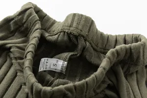 Casual knit pants waistband detail, comfortable elastic design with inner size and wash label.