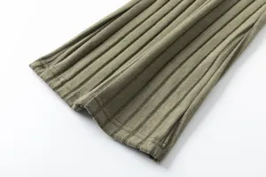 Close-up detail of knitted ribbed trousers cuff in khaki, soft and comfortable fabric texture.