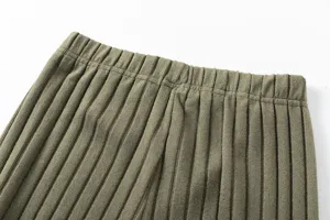 Detailed view of the elastic waistband and vertical ribbed knit texture on comfortable pants.