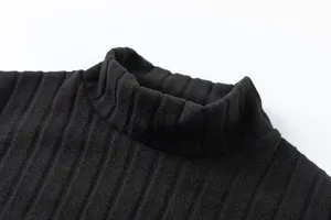 Black ribbed mock neck sweater detail view, soft knit fabric texture close up display