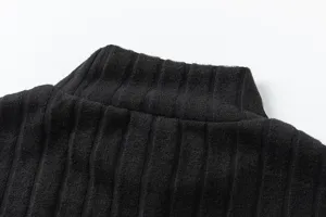 Detailed view of the black ribbed turtleneck knit sweater, showing soft fabric texture.