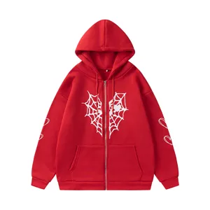 Sweat à capuche zippé rouge avec imprimé cœur toile d'araignée blanche et doublure polaire.