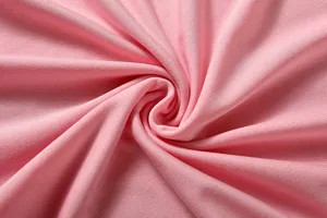 Pink fabric detail of women casual sportswear set, soft smooth knit texture close up.