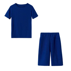 Set sportivo donna top manica corta e pantaloncini trama nido d'ape blu dettaglio.