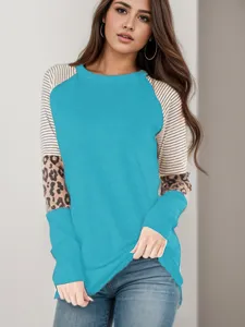 Women's color block long sleeve t-shirt with striped and leopard print design round neck.