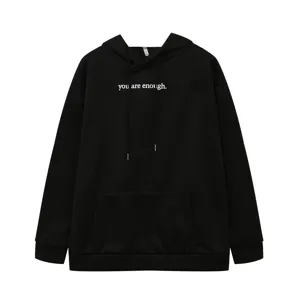 Detailed front view of the black fleece hoodie featuring a chest quote print and pocket.