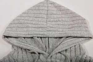 Close-up detail view of gray ribbed knit hoodie hood featuring soft texture and drawstrings.