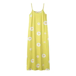 Yellow long slip dress detail featuring a cute white daisy print pattern close-up view.