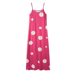 Daisy print slip maxi dress detail view, showing the floral pattern and slim spaghetti strap fit.