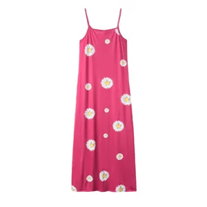 Pink floral slip dress featuring a charming white daisy print, elegant long camisole design.
