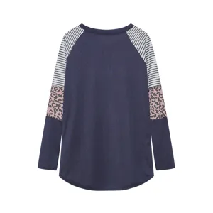 Close-up of long sleeve, color block stripe and leopard pattern, casual top texture detail view.
