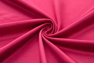 High quality pink fabric detail view showcasing soft texture and elegant spiral drape.