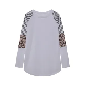 Detailed view of women's long sleeve t-shirt with striped and leopard colorblock sleeves.