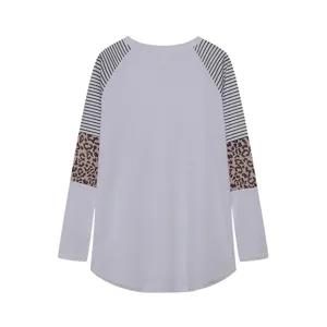 Details of women's long sleeve colorblock t-shirt, featuring striped and leopard sleeves.