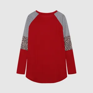 Detailed view of the women's color-blocked long sleeve top featuring leopard and stripe patterns.
