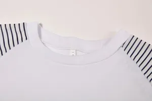 Close-up view of a casual round neck long sleeve t-shirt with striped patchwork.