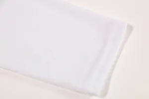 White fabric cuff detail shot of casual long sleeve t-shirt, premium knit texture material.
