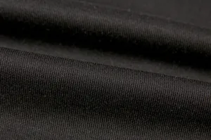 Black knit fabric detail, soft and breathable casual clothing material texture close-up