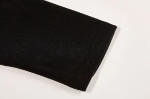Black knitted long sleeve t-shirt detail cuff fabric texture close up view display