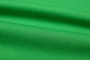 Green knitted fabric detail shot featuring fine texture, soft feel and flexible knit design.