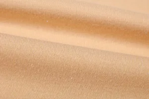 Close-up detail of soft knit fabric texture, comfortable stretch material for autumn apparel.