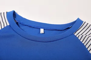 Detail view of women's blue colorblock striped crewneck long sleeve t-shirt collar design.