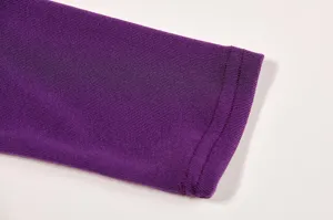 Detailed close up view of the purple long sleeve t-shirt cuff soft fabric texture.