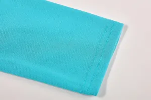 Turquoise long sleeve T-shirt cuff detail shot showing fine knit texture and neat double stitching.
