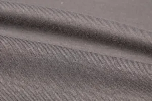 Close-up detail view of soft grey knit fabric showing fine texture and natural clothing folds.