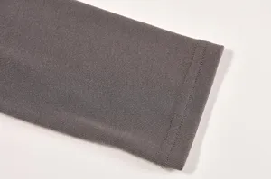 Close-up detail shot of women grey knit long sleeve t-shirt cuff, premium fabric quality.