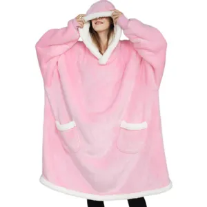 Detailed view of the pink plush sherpa hoodie blanket with front pocket and cozy hood.