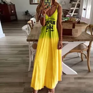 Detail shot of the yellow green gradient slip dress, showcasing front chest letter print.