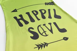 Green long dress detail featuring retro Hippie Soul letter and arrow print for summer.
