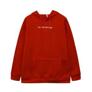 Detailed view of red fleece-lined hoodie with inspirational chest text, kangaroo pocket and drawstring.