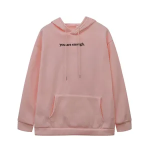 Women's pink fleece-lined hoodie with kangaroo pocket, drawstring, and motivational letter print.