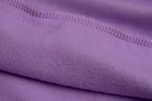 Close-up detail of purple fleece fabric, showing soft plush interior texture and fine stitching.
