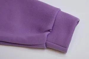 Purple fleece-lined hoodie cuff detail showing soft knit fabric and ribbed design.