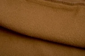 Brown fleece fabric detail close-up showing soft texture and cozy winter sweatshirt material.