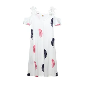 White cold shoulder short sleeve dress with pink feather print and delicate lace trim details.