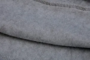 Close-up detail of grey fleece fabric for women hoodie, soft texture and fine stitching.