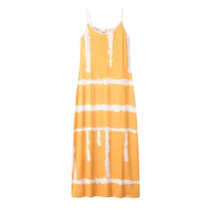 Close-up detail of the yellow and white striped pattern, spaghetti straps, and maxi length hem.